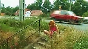 Girl Takes A Piss Next To A  Street