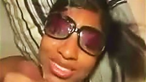 Black Babe In Sunglasses Jacks Off A Cock