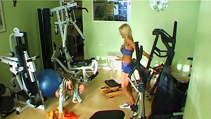 Sporty Lesbians With Fake Tits Fuck Using Toys In The Gym
